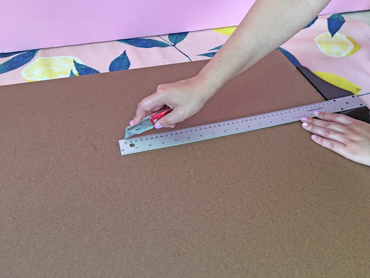 How to build a dog ramp tutorial - cut the hardboard with a razor knife into 15 inches wide by 48 inches long
