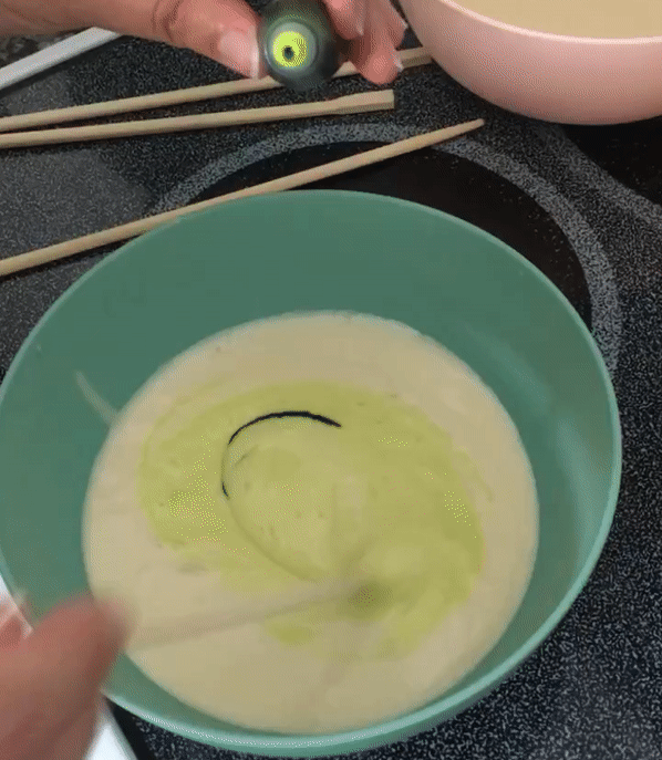 Making Rainbow Belgian Waffles. Add drops of food coloring to batter